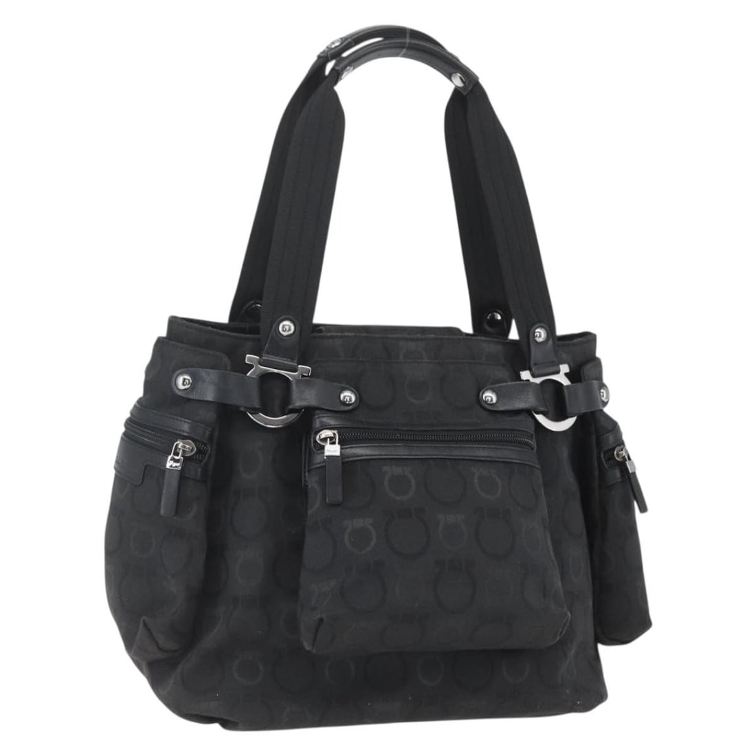 Black Nylon Gancini Tote by Salvatore Ferragamo Silver Hardware: Black Nylon Gancini Tote by Salvatore Ferragamo Silver Hardware This Salvatore Ferragamo Gancini tote bag features a black nylon exterior with silver-tone accents. It is designed with a spacious inter