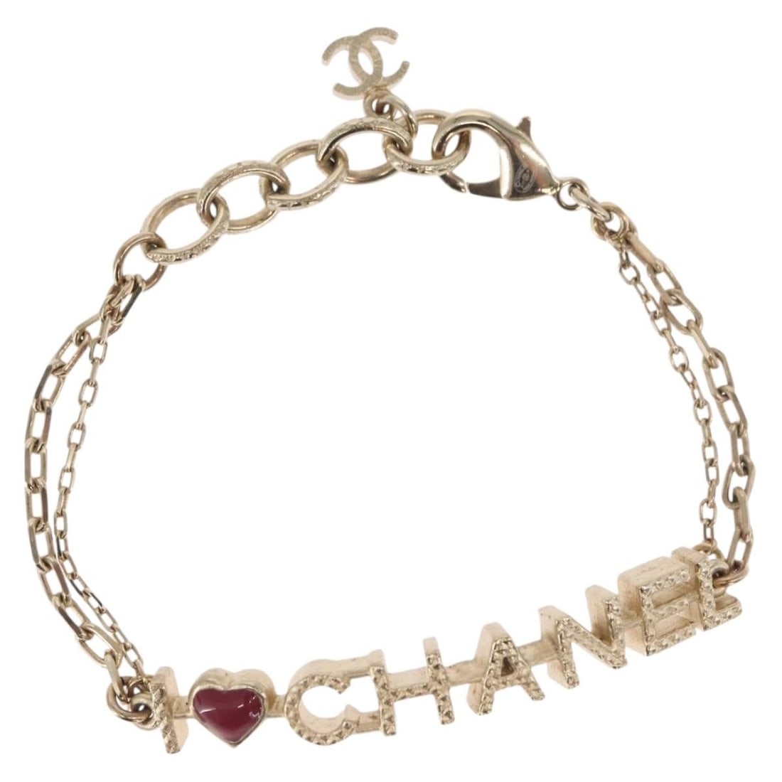 Champagne Gold Metal Bracelet with CC Logo by CHANEL: Champagne Gold Metal Bracelet with CC Logo by CHANEL This CHANEL bracelet features a sleek metal design in a champagne gold color. Crafted in France, the bracelet measures approximately 18 cm (7.1 inc