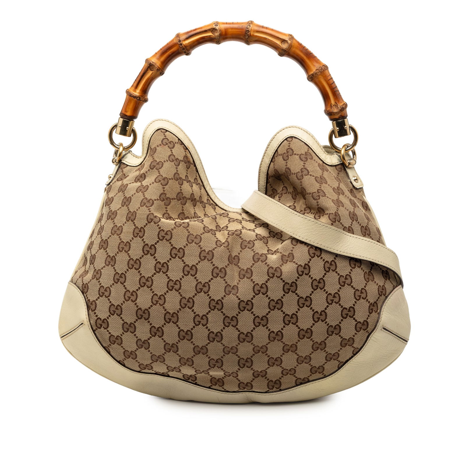 Medium Peggy satchel in GG canvas with bamboo handle by Gucci: Medium Peggy satchel in GG canvas with bamboo handle by Gucci This Gucci Medium GG Canvas Peggy Satchel features a canvas body with leather trim, a distinctive bamboo top handle, a flat leather strap,
