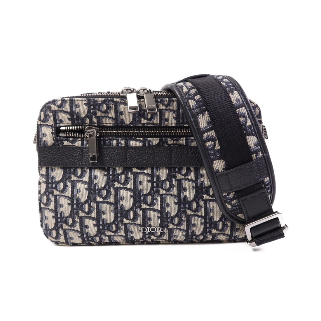 Dior Safari Blue Canvas Shoulder Bag with Silver Hardware: Dior Safari Blue Canvas Shoulder Bag with Silver Hardware This Christian Dior Safari shoulder bag features a blue canvas exterior and silver-tone hardware. The bag is crafted in France and offers a co