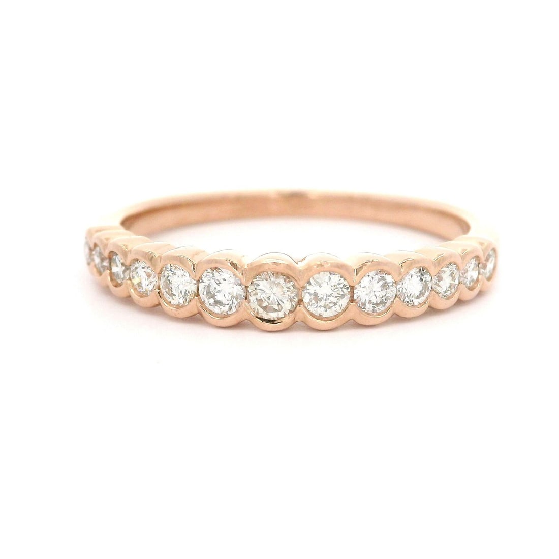 14k Rose Gold Stackable Band Ring with 0.50ctw Diamond: 14k Rose Gold Stackable Band Ring with 0.50ctw Diamond This exquisite 14k Rose Gold band features a stunning graduated half bezel channel setting adorned with 13 natural diamonds. The round brilliant-