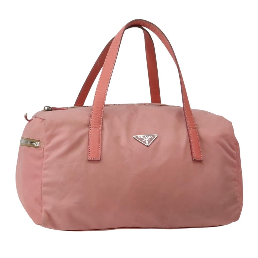 Prada Pink Nylon Side Pocket Bauletto Handbag with Leather Trim: Prada Pink Nylon Side Pocket Bauletto Handbag with Leather Trim This Prada Side Pocket Bauletto Bag features a pink nylon exterior with leather accents, designed for women. The handbag offers practica