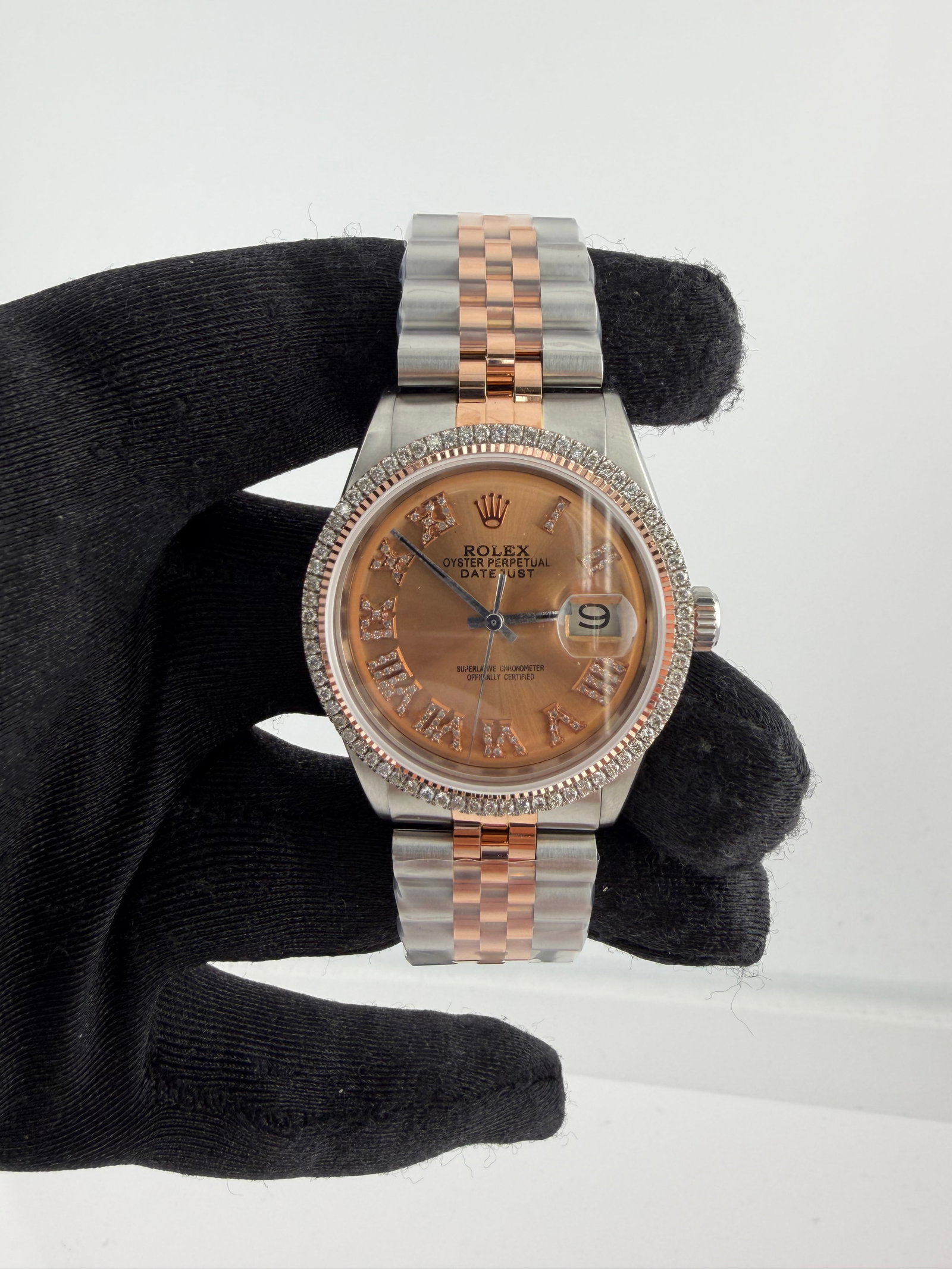 AM Pink Roman Diamond Dial Jubilee Bracelet for Rolex Datejust Ref 1601: AM Pink Roman Diamond Dial Jubilee Bracelet for Rolex Datejust Ref 1601 This Rolex Datejust watch features an aftermarket pink Roman diamond dial and an aftermarket Jubilee bracelet. The timepiece inc