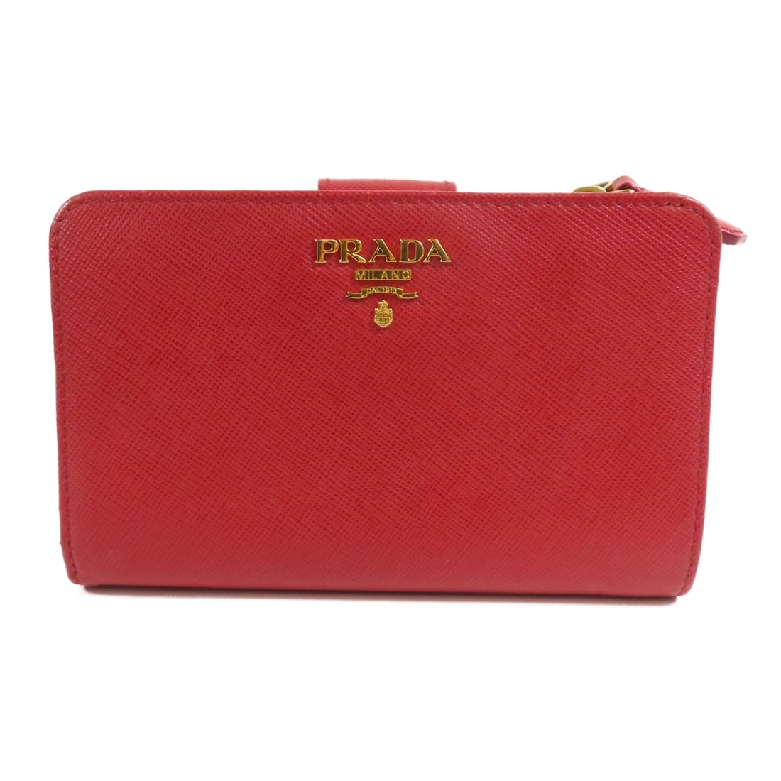 Red Saffiano Leather Bi-fold Wallet by Prada 1M1225 with Gold Hardware: Red Saffiano Leather Bi-fold Wallet by Prada 1M1225 with Gold Hardware This Prada bi-fold wallet is crafted from Saffiano leather in a striking red color. Made in Italy, it features a classic bi-fold