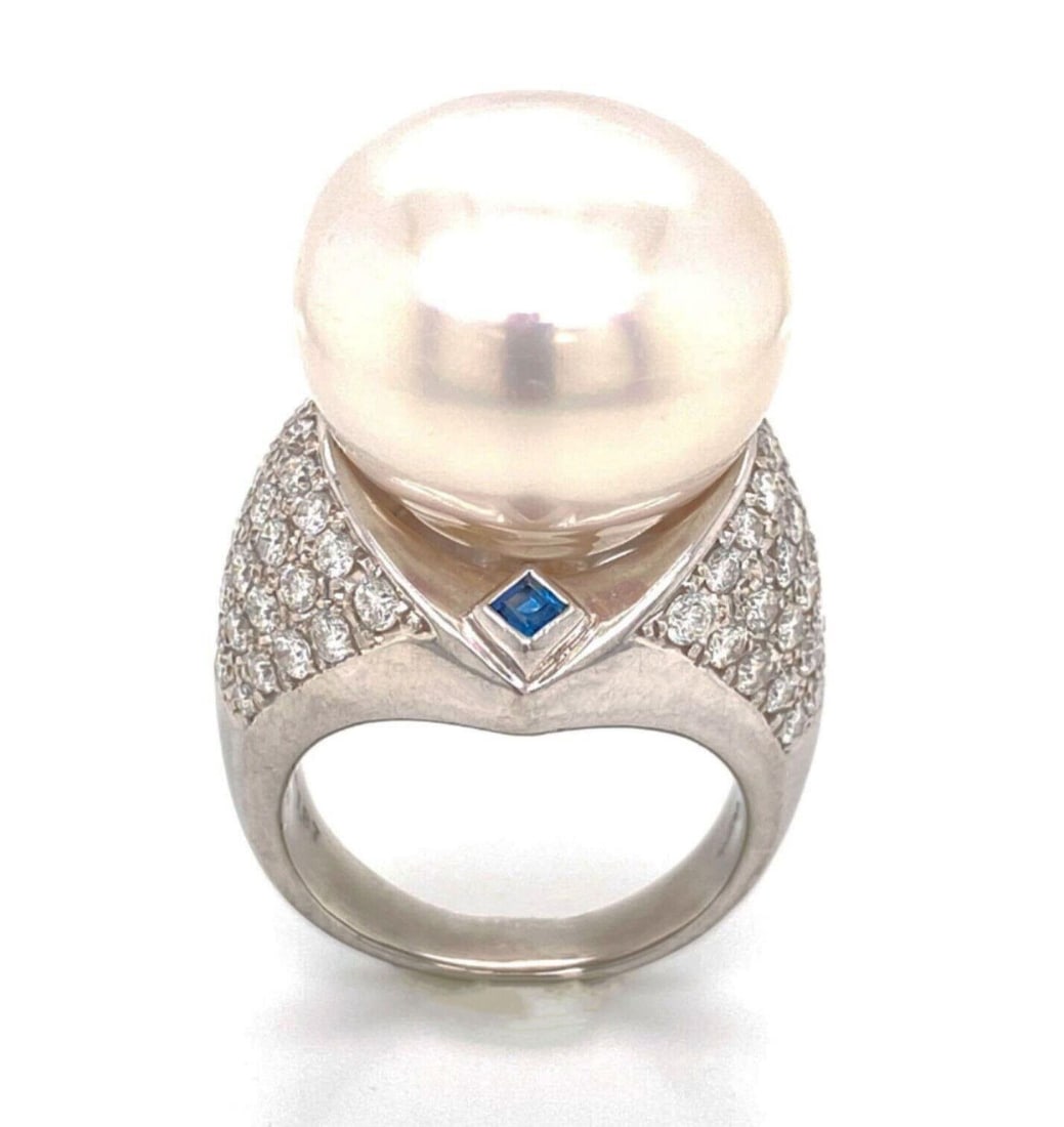 Size 8 Platinum Cocktail Ring with 17mm Pearl Diamonds and Sapphires: Size 8 Platinum Cocktail Ring with 17mm Pearl Diamonds and Sapphires This platinum cocktail ring features a large 17mm natural pearl as its centerpiece, surrounded by vibrant blue sapphires and sparkl