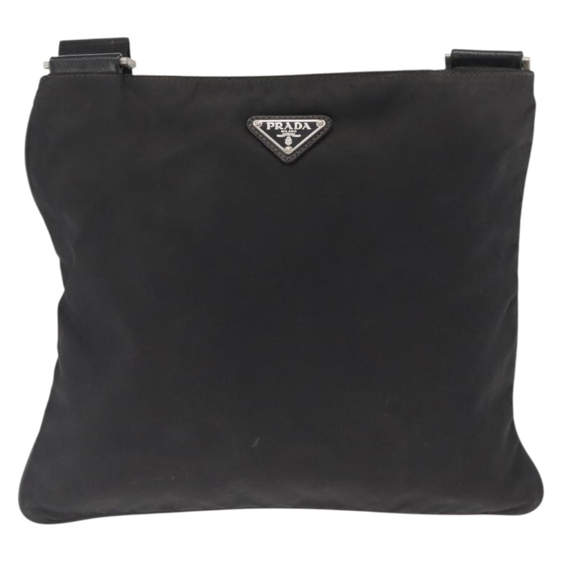 Nylon Unisex Messenger Bag by Prada in Black: Nylon Unisex Messenger Bag by Prada in Black This Prada Flat Messenger Bag is crafted from durable black nylon and designed as a unisex accessory. Featuring a spacious interior with pockets, it offers