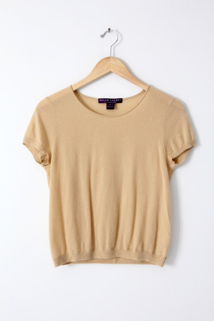 Ralph Lauren Collection Purple Label Vintage Cashmere Short Sleeve Sweater: Ralph Lauren Collection Purple Label Vintage Cashmere Short Sleeve Sweater This vintage Ralph Lauren Collection top is crafted in Italy from 100% pure cashmere. The creamy beige short-sleeve sweater f
