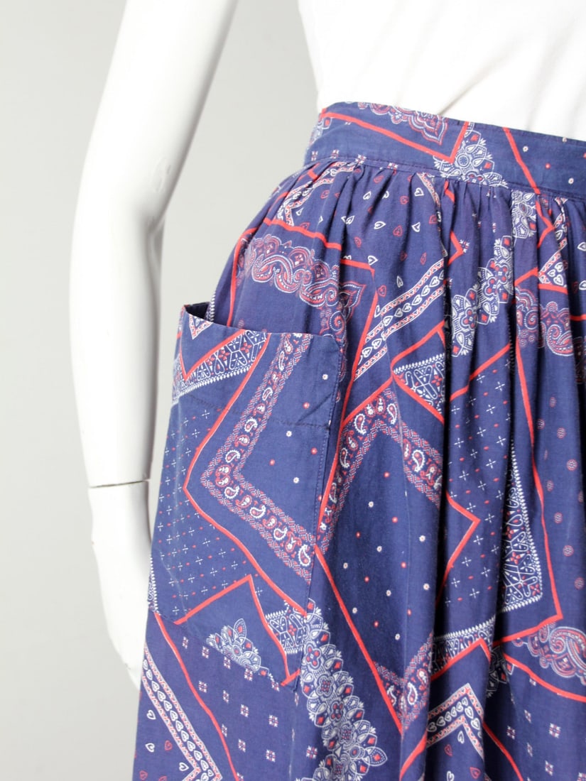 1950s Vintage Bandana Print Cotton Skirt with Pockets: 1950s Vintage Bandana Print Cotton Skirt with Pockets Step back in time with this charming 1950s vintage bandana print skirt. Crafted from hand-made blue cotton, it showcases a delightful white and re
