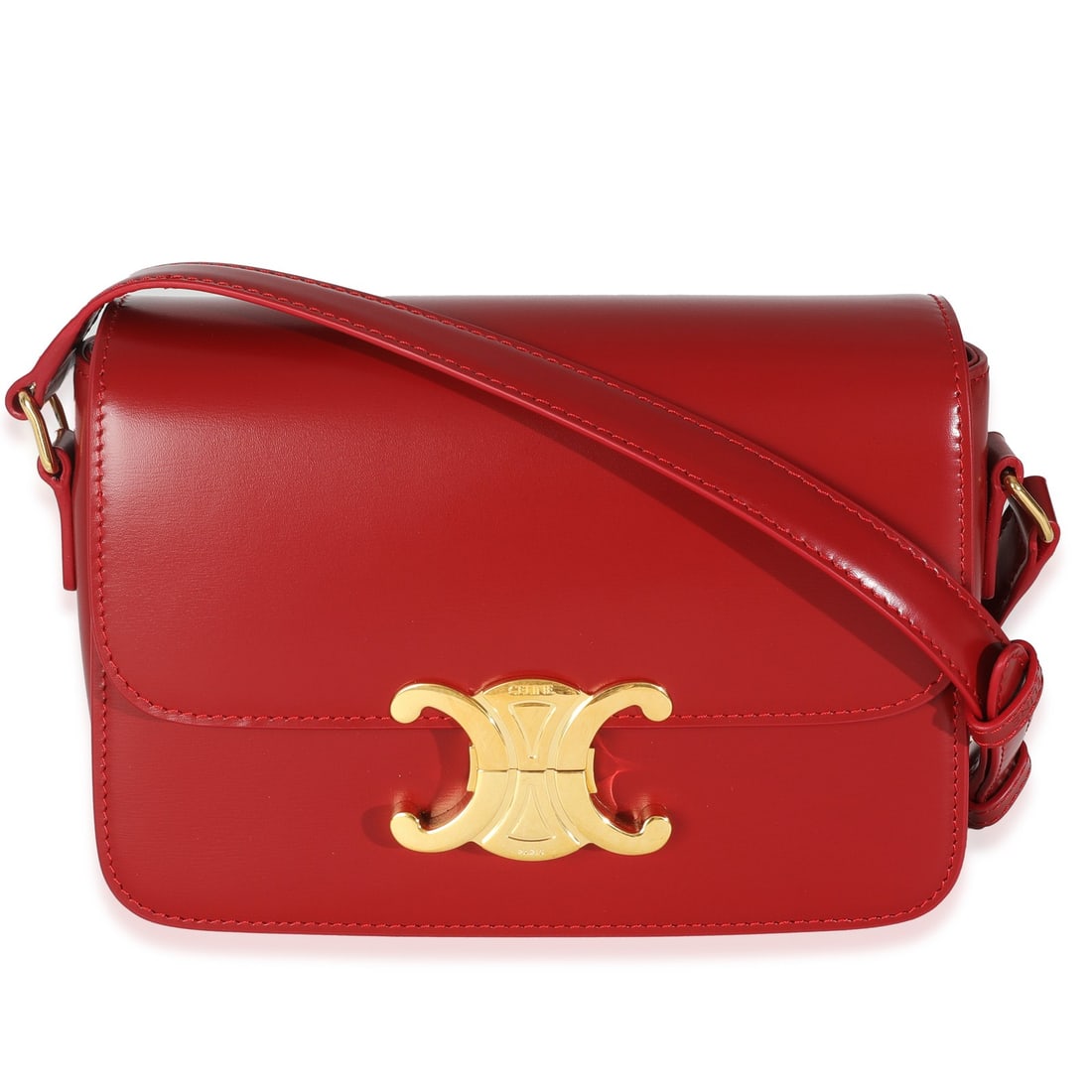 Teen Triomphe red leather shoulder bag by Celine with dustbag: Teen Triomphe red leather shoulder bag by Celine with dustbag This Celine Teen Triomphe shoulder bag is crafted in red shiny calfskin leather with a matching leather lining. It features a push lock cl