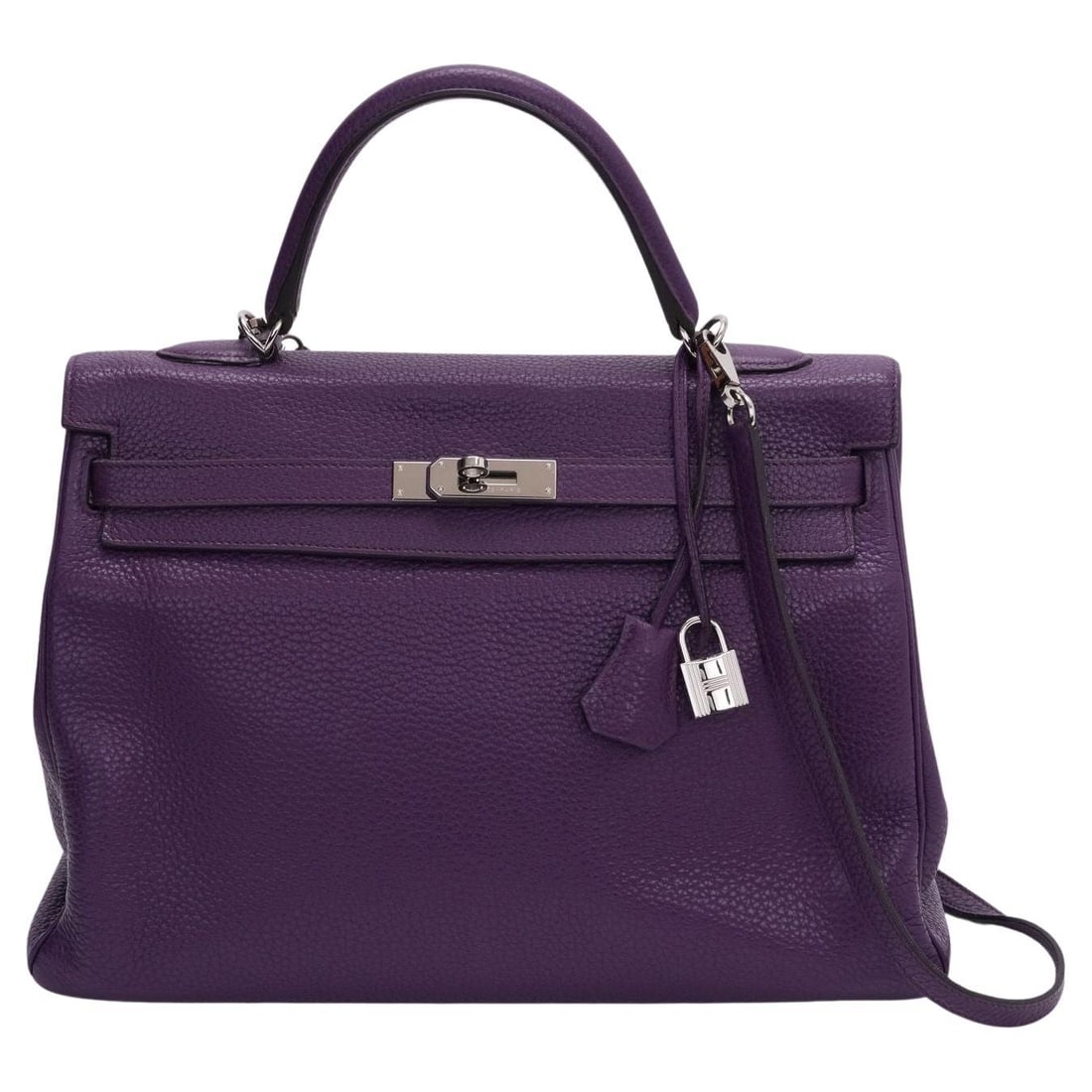 Hermes Kelly 35 Retourne Ultraviolet Clemence Leather Bag: Hermes Kelly 35 Retourne Ultraviolet Clemence Leather Bag This exquisite Hermes Kelly 35 Retourne Bag is crafted from luxurious clemence leather in a striking ultraviolet hue. Measuring 9.75 inches in