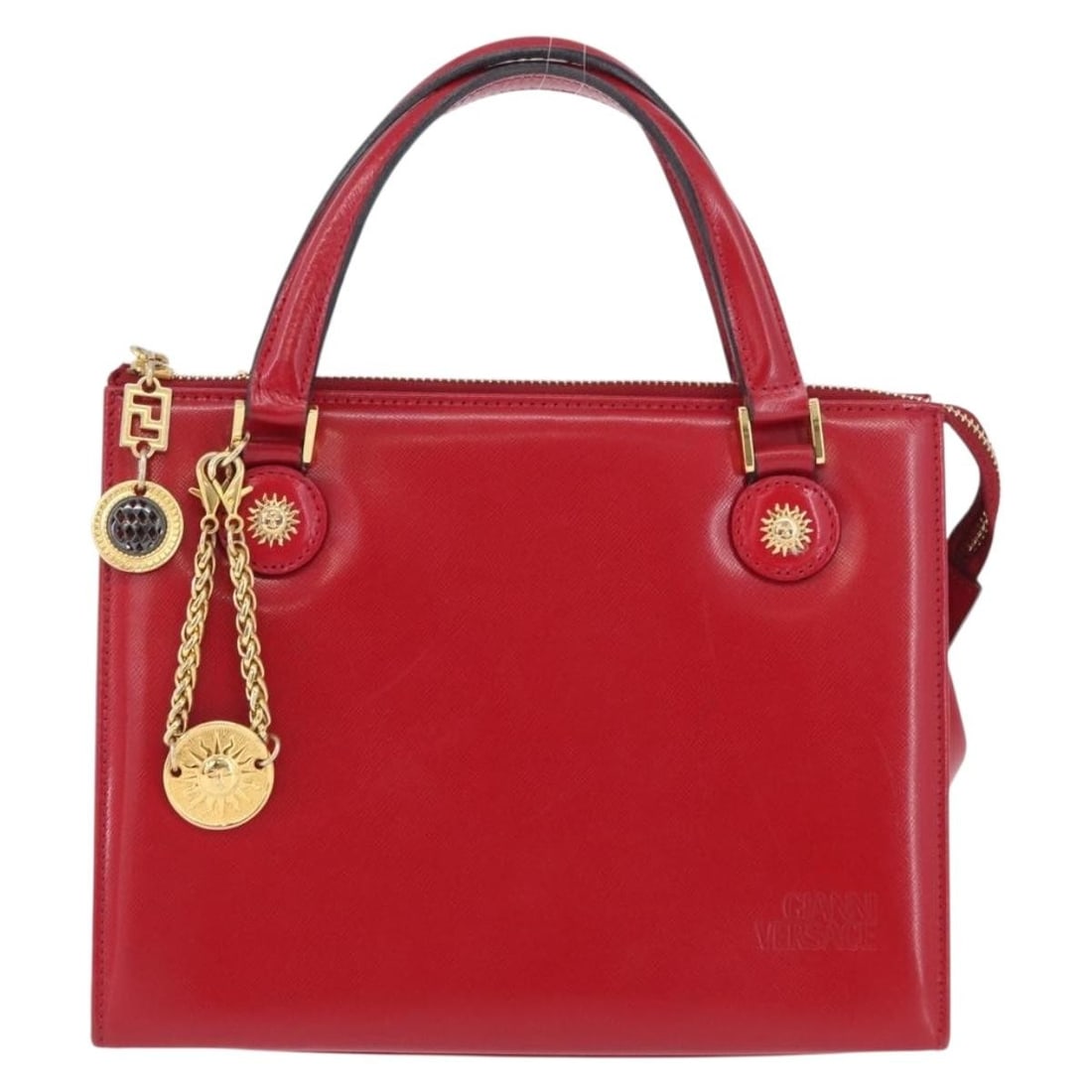 Red Leather Vintage Versace Handbag for Women: Red Leather Vintage Versace Handbag for Women This Versace vintage handbag is crafted from red leather and designed for women. Made in Italy, it features a classic silhouette with metal fittings. The