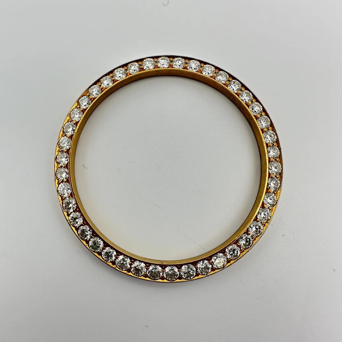 2.25ct Diamond Gold Alloy Bezel for 36mm Rolex Watch Custom Fit: 2.25ct Diamond Gold Alloy Bezel for 36mm Rolex Watch Custom Fit This pre-owned custom bezel is crafted from alloy and features a total diamond weight of 2.25 carats. Designed in a gold color, it is co