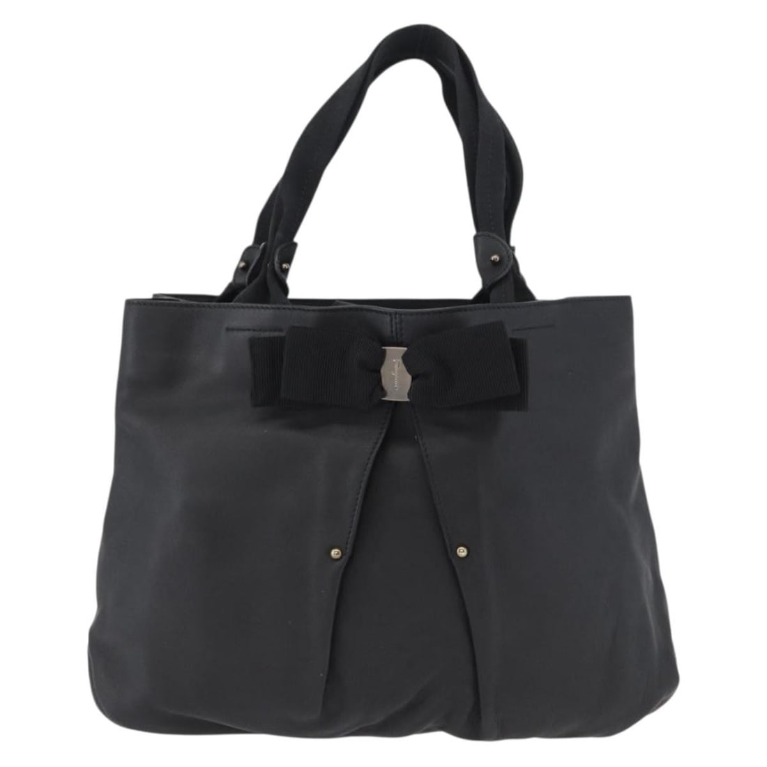 Leather Vala Tote Bag by Salvatore Ferragamo in Black: Leather Vala Tote Bag by Salvatore Ferragamo in Black This Salvatore Ferragamo Vala tote is crafted from black leather and designed for women. Made in Italy, it features a spacious interior and elegan