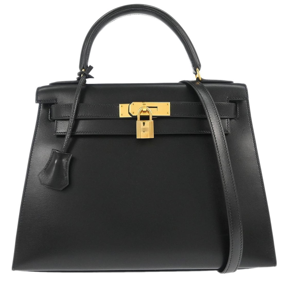 Kelly 28 Black Leather Sellier Top Handle Bag by Hermes: Kelly 28 Black Leather Sellier Top Handle Bag by Hermes This Hermes Kelly 28 Sellier 2-way handbag features a structured silhouette in black box calf leather. It offers versatile carrying options with