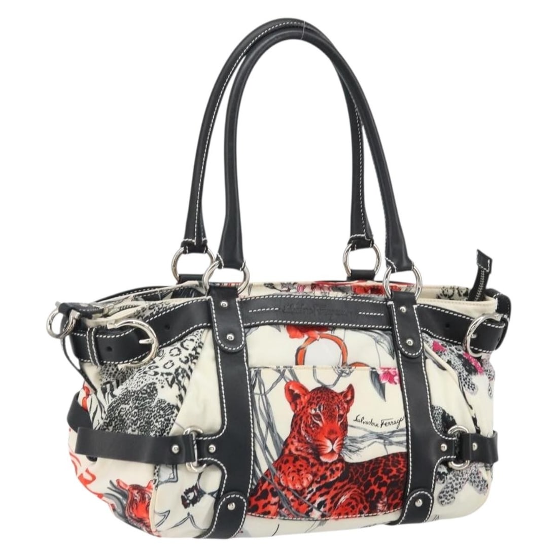 White Nylon Handbag with Silver Accents by Salvatore Ferragamo: White Nylon Handbag with Silver Accents by Salvatore Ferragamo This Salvatore Ferragamo handbag is crafted from white and silver nylon, offering a stylish and versatile accessory. Made in Italy, the b