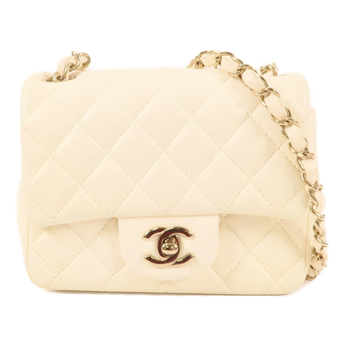 White Lambskin Mini Flap Shoulder Bag by Chanel with Gold Hardware: White Lambskin Mini Flap Shoulder Bag by Chanel with Gold Hardware This CHANEL mini flap shoulder bag features luxurious white lambskin leather and classic CC detailing. Designed in a compact silhouet