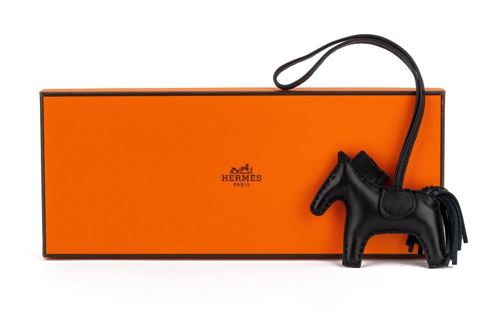 Hermes Rare So Black Rodeo Grigri PM Leather Bag Charm with Box: Hermes Rare So Black Rodeo Grigri PM Leather Bag Charm with Box Elevate your accessory collection with this exquisite Hermes Rare So Black Rodeo Grigri PM bag charm. Crafted from luxurious all-black l