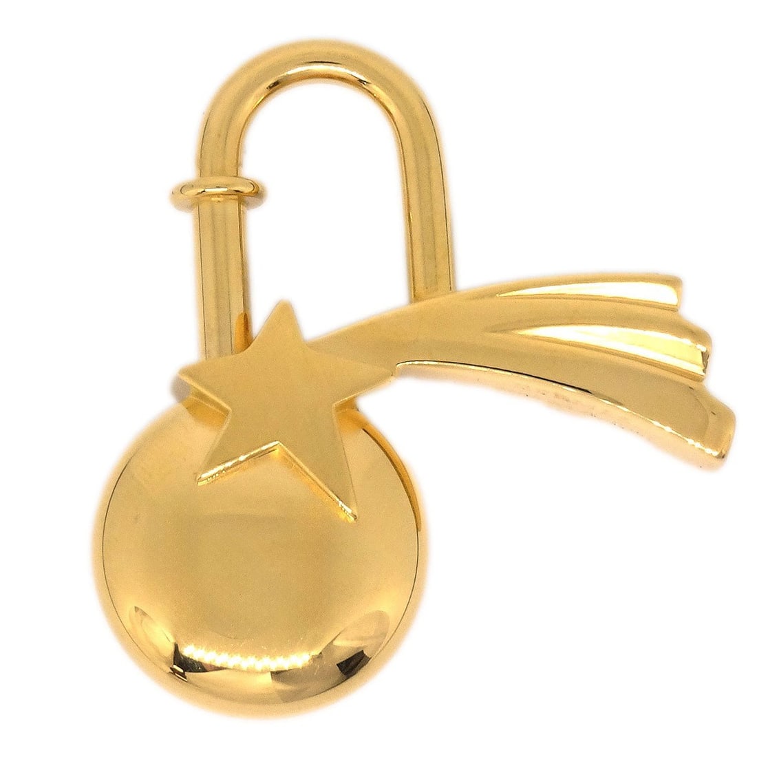 1999 Shooting Star Gold Cadena Charm by Hermes: 1999 Shooting Star Gold Cadena Charm by Hermes This is a vintage 1999 Hermes Shooting Star Cadena charm in a small size with a gold tone finish. Made in France, it features a charming star design and