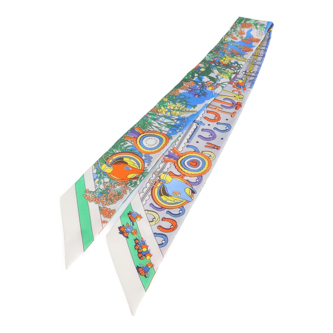 Silk Twilly Scarf by Hermes Multicolor Design: Silk Twilly Scarf by Hermes Multicolor Design This Hermes Twilly scarf is crafted from luxurious silk and features a vibrant multicolor design. Made in France, it offers a versatile and elegant access