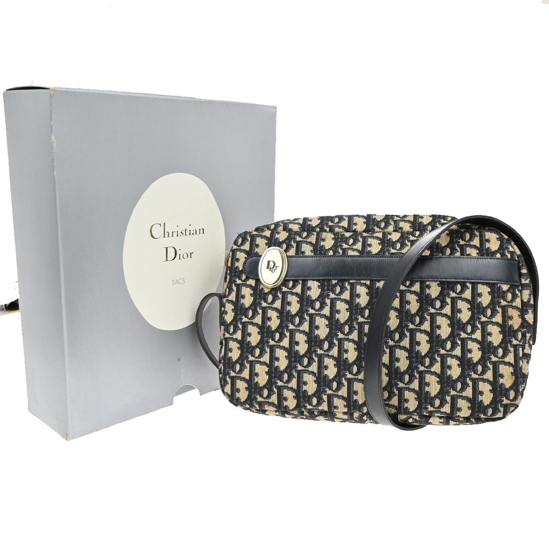 Christian Dior Trotter Blue Canvas Vintage Shoulder Bag France: Christian Dior Trotter Blue Canvas Vintage Shoulder Bag France This Christian Dior Vintage Trotter Shoulder Bag is crafted from blue canvas and designed for women. It features a classic shoulder bag s