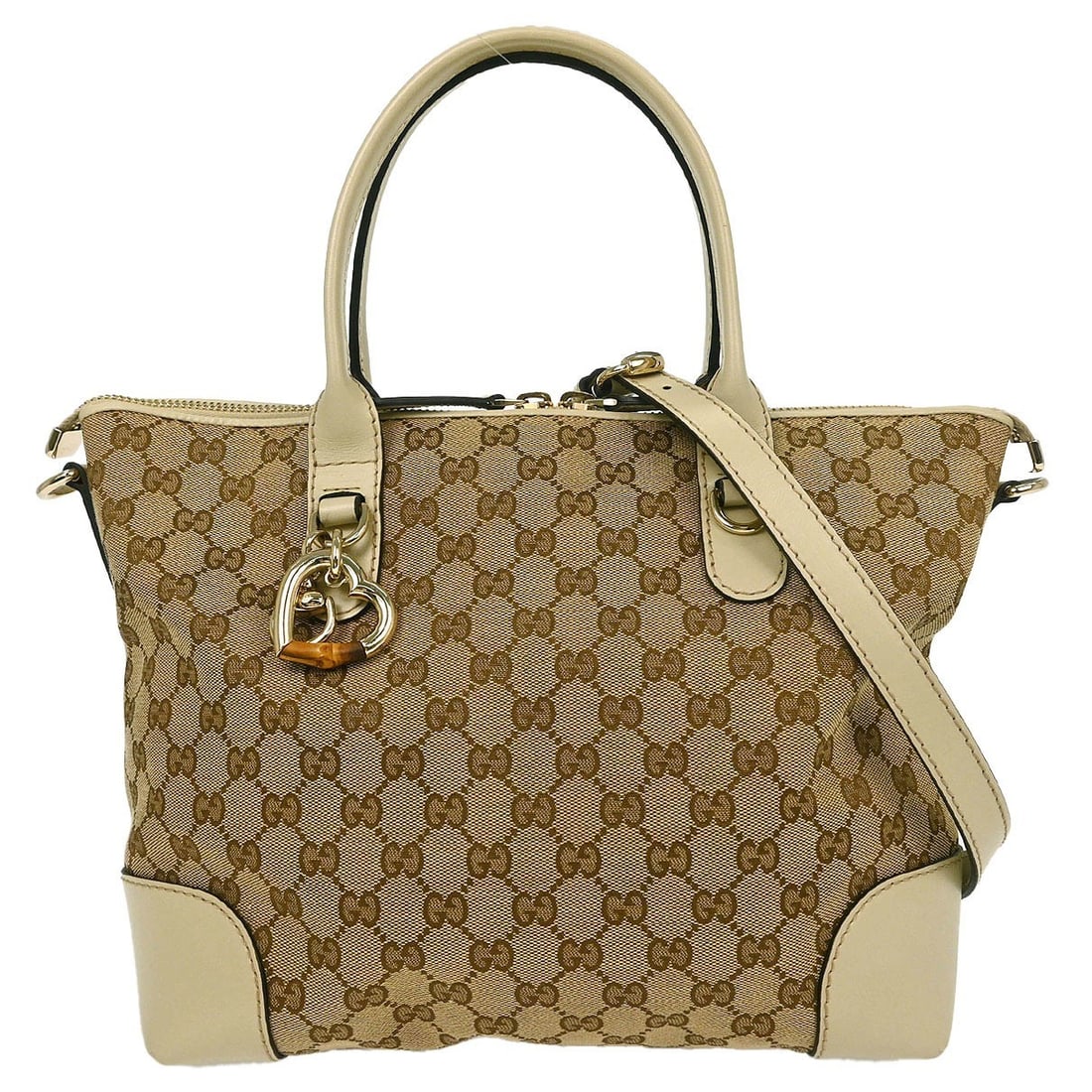 Gucci Beige Heart Bit Canvas Leather 2way Tote Bag 269957 520981: Gucci Beige Heart Bit Canvas Leather 2way Tote Bag 269957 520981 This Gucci Beige Heart Bit GG 2-way Tote Bag is the perfect blend of elegance and functionality. Crafted from high-quality canvas leath
