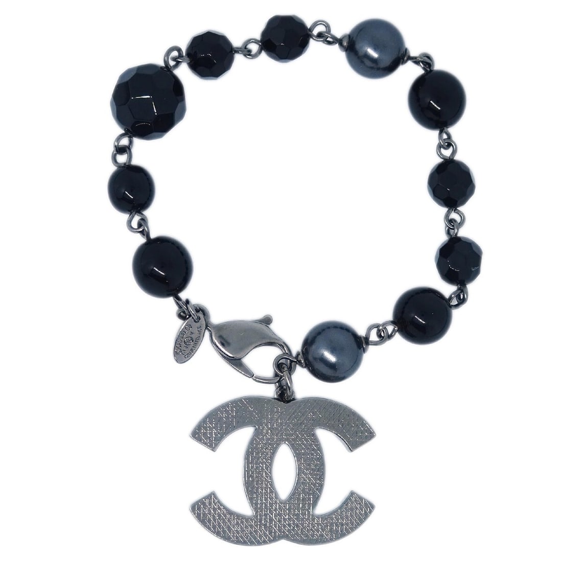 Chanel Black Chain Bracelet with Acrylic Silver Plated Pearls: Chanel Black Chain Bracelet with Acrylic Silver Plated Pearls This stylish Chanel bracelet features a chic black chain design, adorned with elegant acrylic silver plated artificial pearls. A perfect a