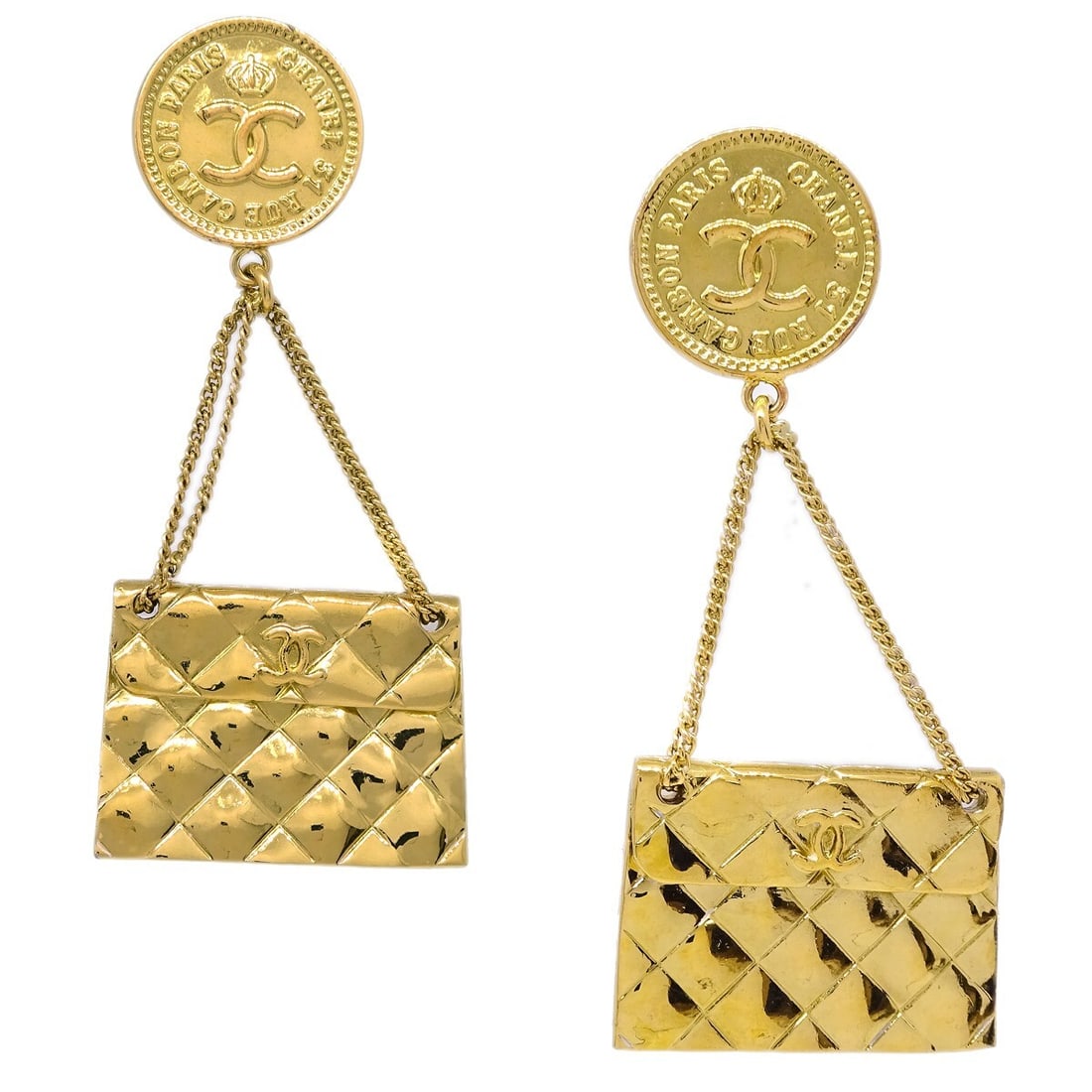 Chanel 94A Gold Clip-On Bag Motif Dangle Earrings: Chanel 94A Gold Clip-On Bag Motif Dangle Earrings Elevate your accessory collection with these stunning Chanel Motif Dangle Earrings. Crafted in a luxurious gold tone, these clip-on earrings feature a