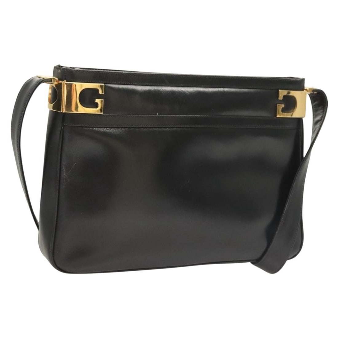 Black Leather Gucci Shoulder Bag Vintage Design: Black Leather Gucci Shoulder Bag Vintage Design This vintage Gucci shoulder bag is crafted from black leather and designed for women. It features a shoulder strap and metal fittings, showing signs of