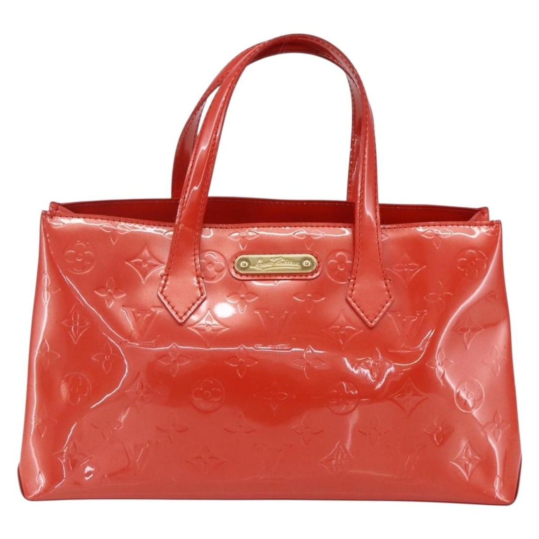 Wilshire Monogram Vernis Orange Patent Leather Tote by Louis Vuitton: Wilshire Monogram Vernis Orange Patent Leather Tote by Louis Vuitton This Louis Vuitton Wilshire handbag features the iconic Monogram Vernis design in orange patent leather. Designed for women, it has