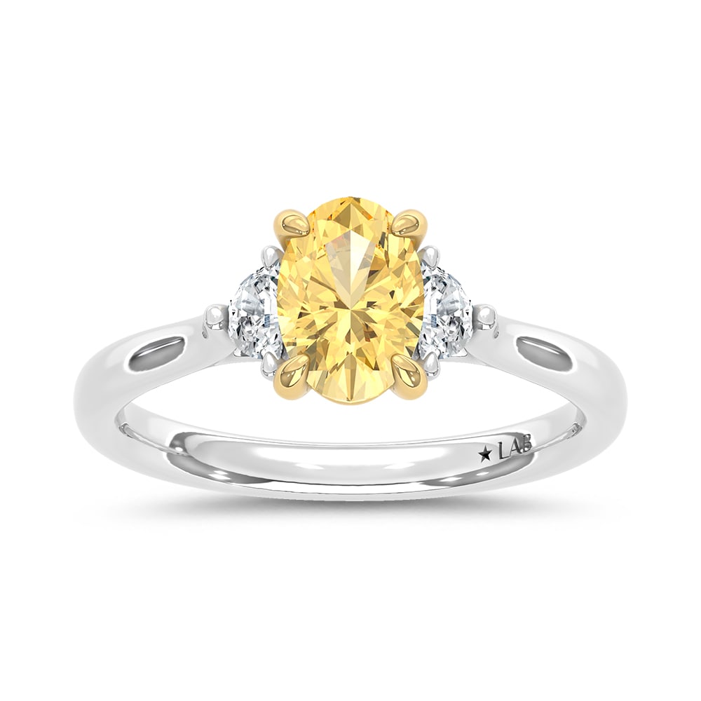 14K Two Tone Gold Lab Grown Diamond 1 1/6 Ct.Tw. Yellow Oval Engagement Ring (Center 1ct): 14K Two Tone Gold Lab Grown Diamond 1 1/6 Ct.Tw. Yellow Oval Engagement Ring (Center 1ct) Exude elegance with this 14K Two-Tone Gold Engagement Ring, featuring a captivating 1-carat lab-grown yellow d
