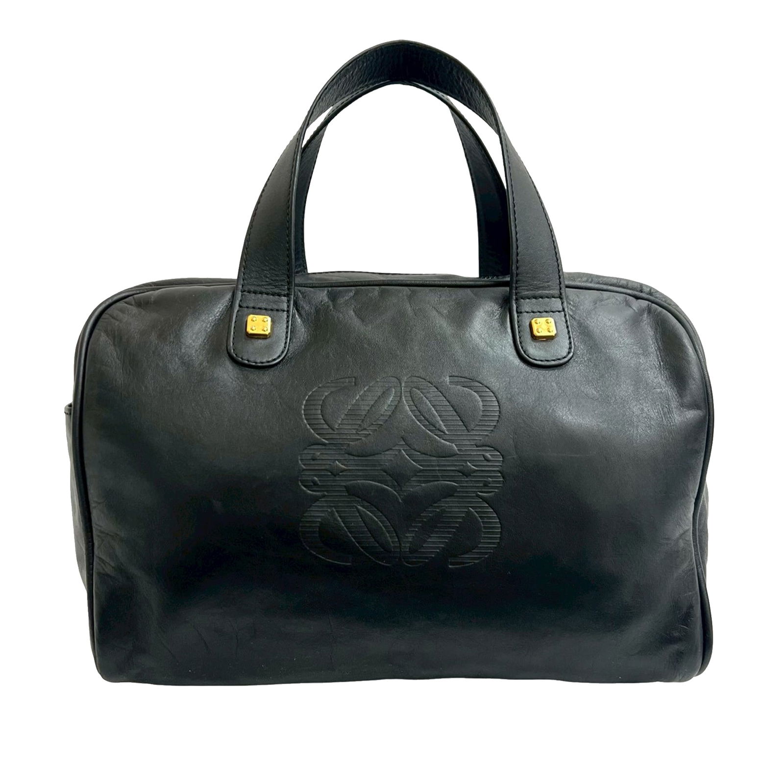 LOEWE Amazona 28 Black Leather Handbag with Side Pocket: LOEWE Amazona 28 Black Leather Handbag with Side Pocket The Amazona 28 bag features a black leather body with flat leather handles, a top zip closure, an exterior side slip pocket, and an interior