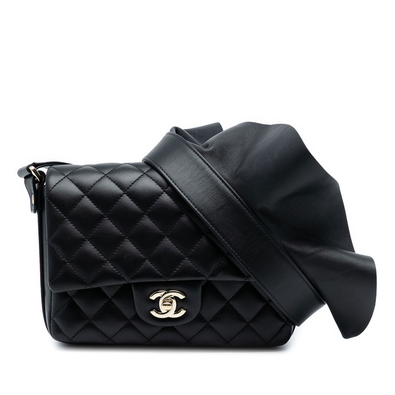 Chanel Bolero Quilted Calfskin Black Crossbody Bag with Flap and CC Turn Lock: Chanel Bolero Quilted Calfskin Black Crossbody Bag with Flap and CC Turn Lock This Chanel crossbody bag showcases a quilted calfskin leather body in black with a flat leather shoulder strap featuring