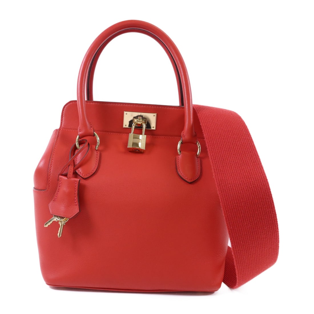 Hermes Tool Box 20 Red Swift Leather Shoulder Bag with Gold Hardware: Hermes Tool Box 20 Red Swift Leather Shoulder Bag with Gold Hardware This Hermes Tool Box 20 is a versatile 2-way shoulder bag crafted from premium calfskin leather in a vibrant red hue. The bag featu