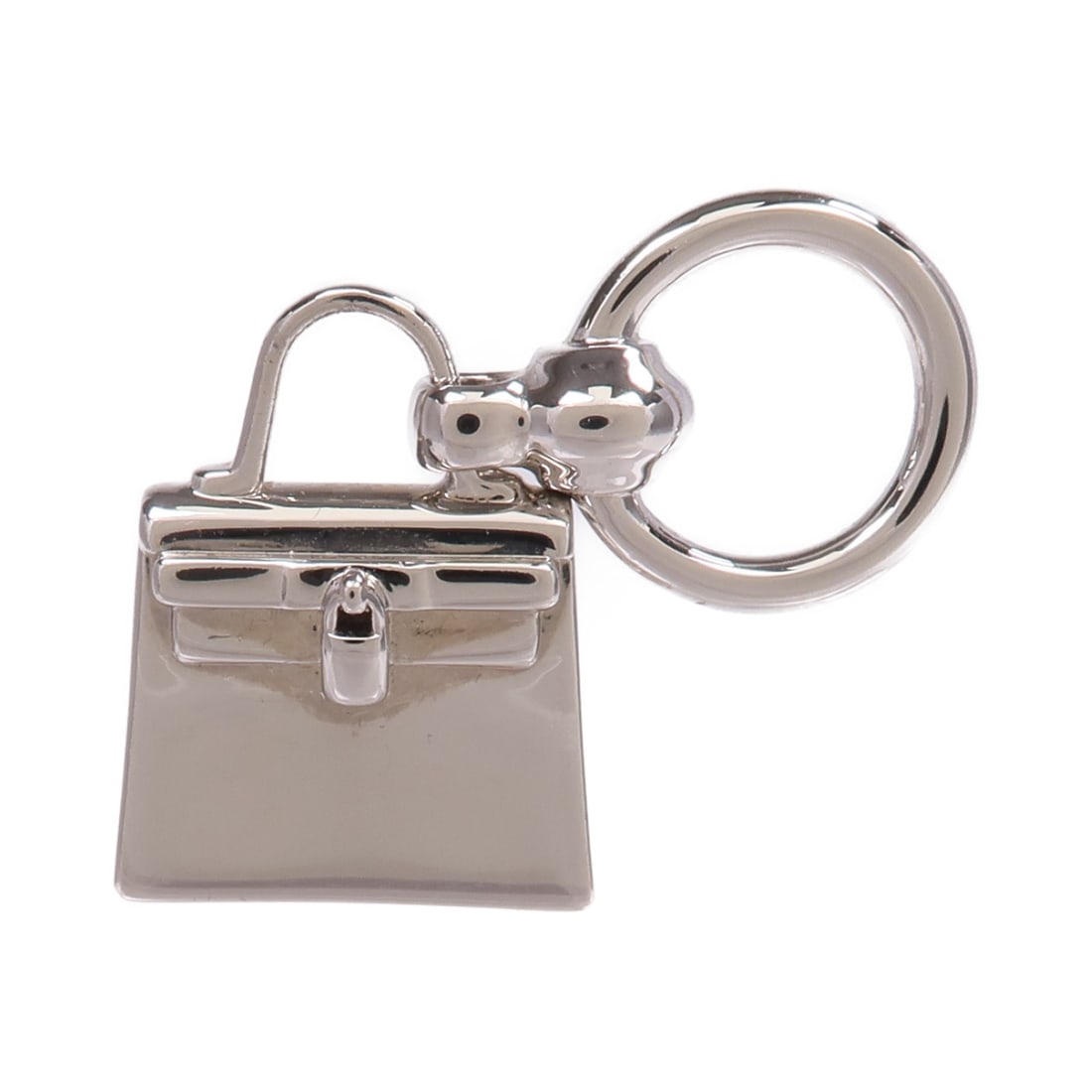 Mini Kelly Twilly Silver Tone Scarf Ring by Hermes: Mini Kelly Twilly Silver Tone Scarf Ring by Hermes This Hermes Mini Kelly Twilly scarf ring features a sleek silver-tone finish. Crafted from metal, it offers a stylish accessory for securing your fav