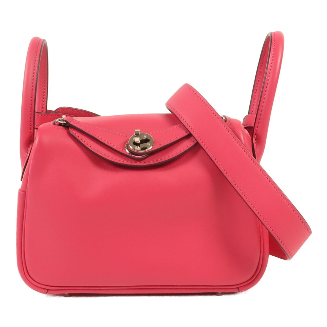 HERMES Mini Lindy 2 Way Bag Swift Leather Pink PHW: HERMES Mini Lindy 2 Way Bag Swift Leather Pink PHW Introducing the HERMES Mini Lindy 2 Way Bag, crafted from premium calfskin leather in a delightful pink hue. This versatile shoulder bag features a s