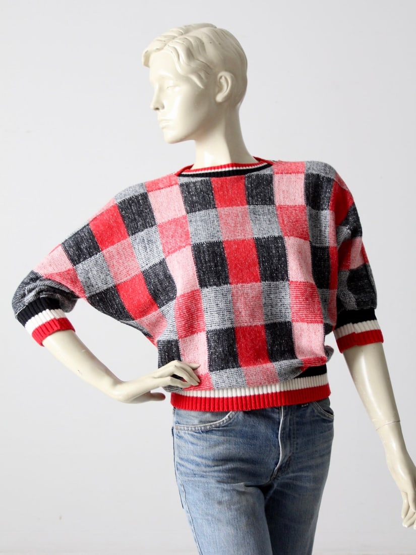 1980s Vintage E.B. Allen Knit Pullover Red Black White Check: 1980s Vintage E.B. Allen Knit Pullover Red Black White Check Step back into the 1980s with this vintage E.B. Allen knit pullover. The light sweater showcases a striking large check pattern in red, bla