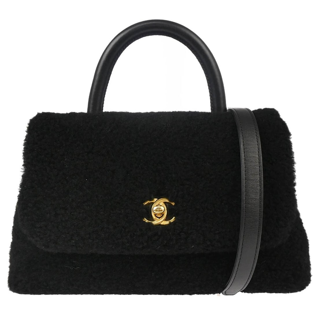 Chanel Black Mouton Top Handle Handbag with Detachable Strap: Chanel Black Mouton Top Handle Handbag with Detachable Strap This stylish Chanel Black Mouton 2way Handbag features a chic design perfect for casual occasions. The bag is crafted from luxurious mouton