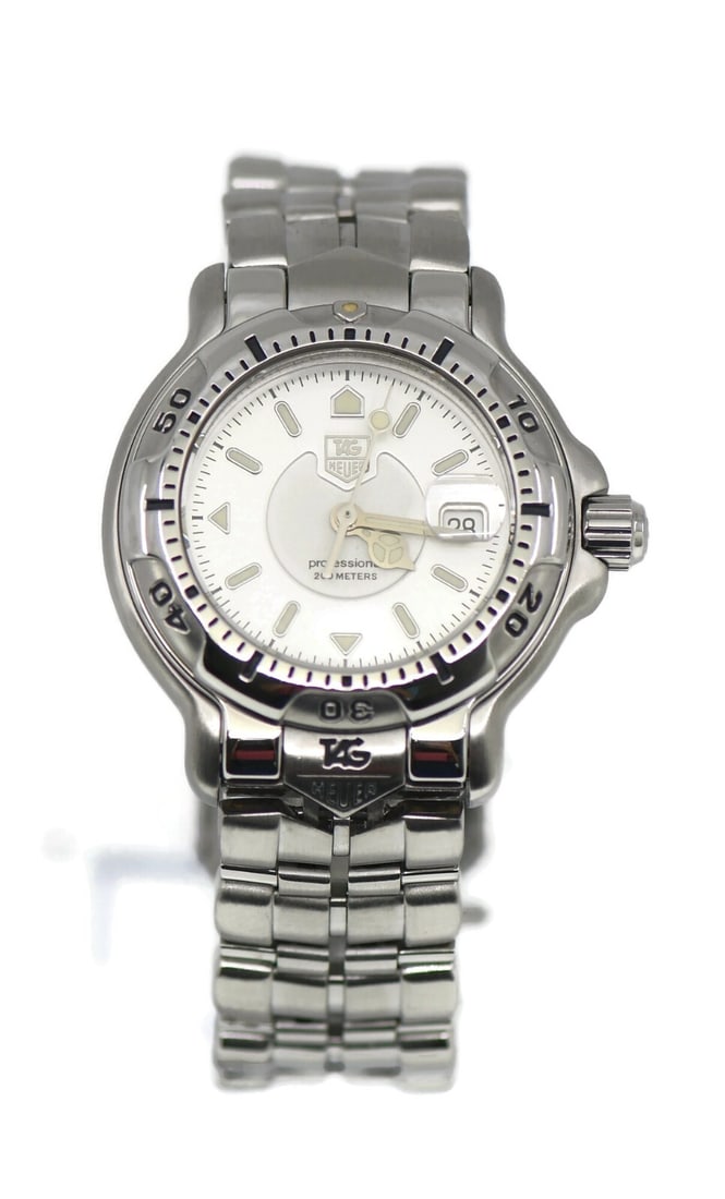 TAG Heuer 6000 Quartz Stainless Steel Watch WH1313 with Box and Papers: TAG Heuer 6000 Quartz Stainless Steel Watch WH1313 with Box and Papers Presenting the TAG Heuer 6000 Stainless Steel Watch, a sophisticated wristwatch designed for both style and functionality. This t