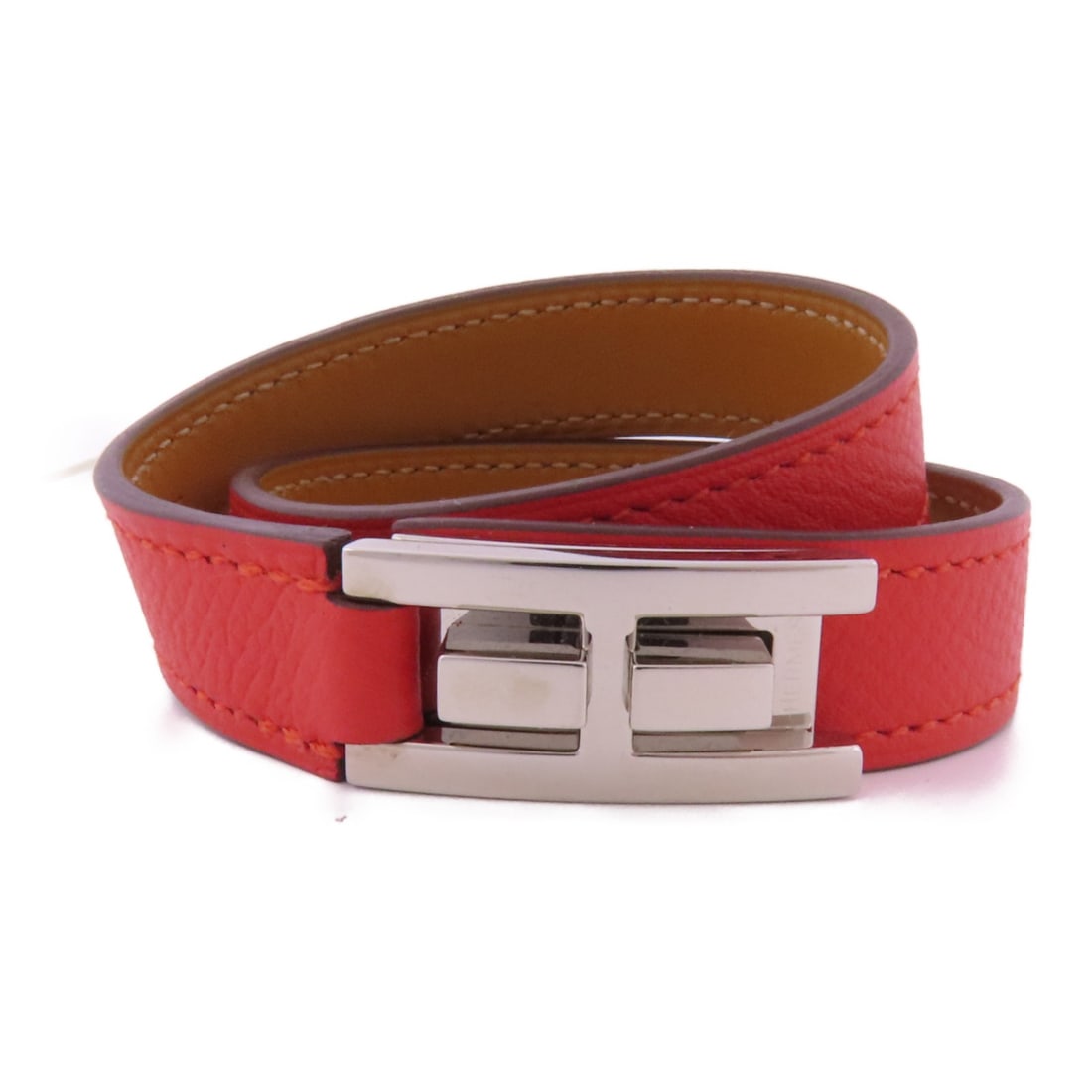 HERMES Red Veau Epsom Leather Bracelet with PHW: HERMES Red Veau Epsom Leather Bracelet with PHW This exquisite HERMES bracelet is crafted from high-quality Veau Epsom leather in a striking red color, showcasing a luxurious and timeless design. The