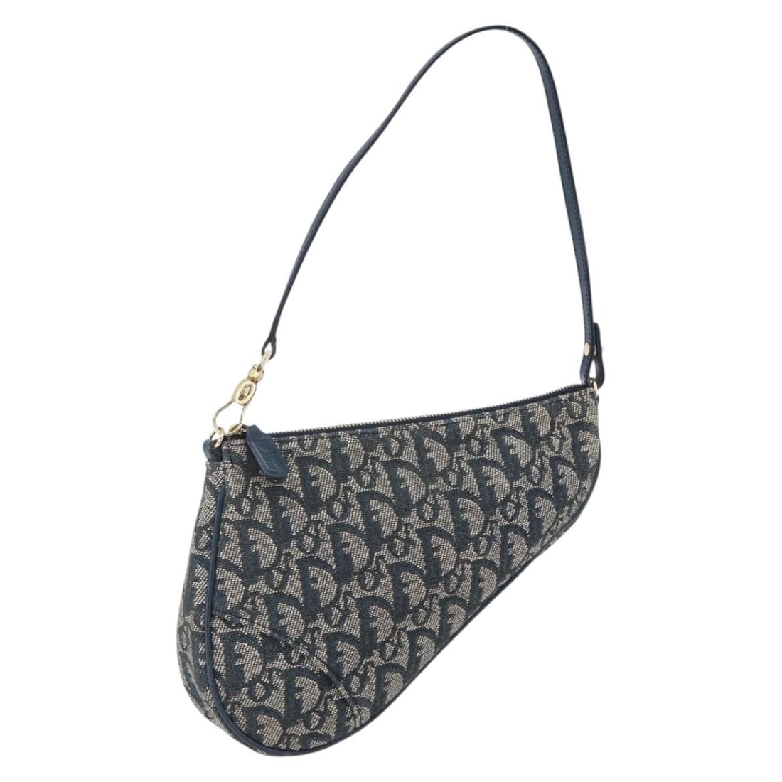 Navy Trotter Canvas Saddle Accessory Pouch by Christian Dior: Navy Trotter Canvas Saddle Accessory Pouch by Christian Dior This Christian Dior accessory pouch features the iconic Trotter canvas in navy and silver tones. Made in Spain, the pouch is designed for d