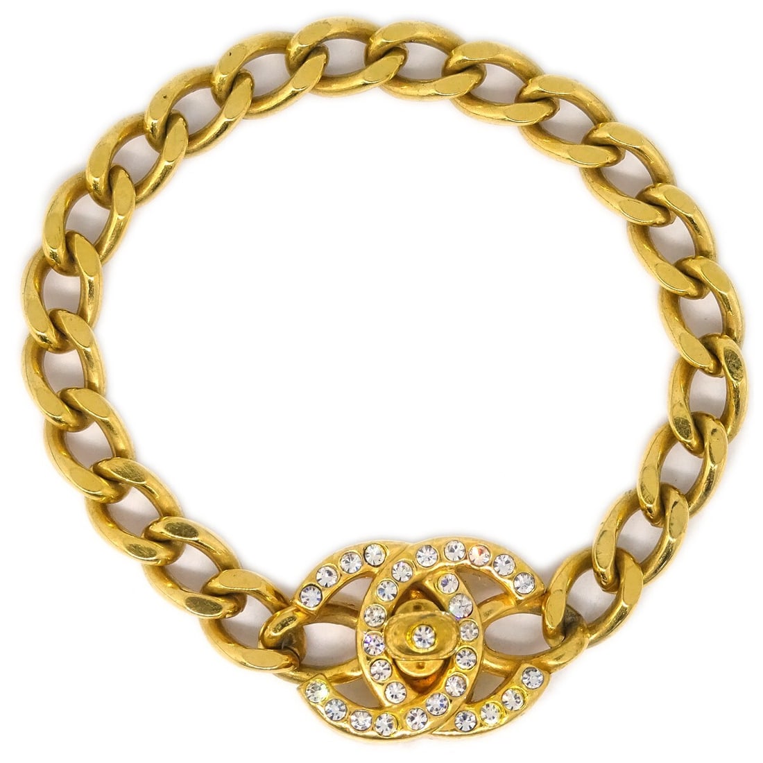 Chanel 96A Gold-Plated Rhinestone Turnlock Chain Bracelet: Chanel 96A Gold-Plated Rhinestone Turnlock Chain Bracelet This exquisite Chanel bracelet features a stunning turnlock design embellished with sparkling rhinestones. Crafted with a luxurious gold-plate