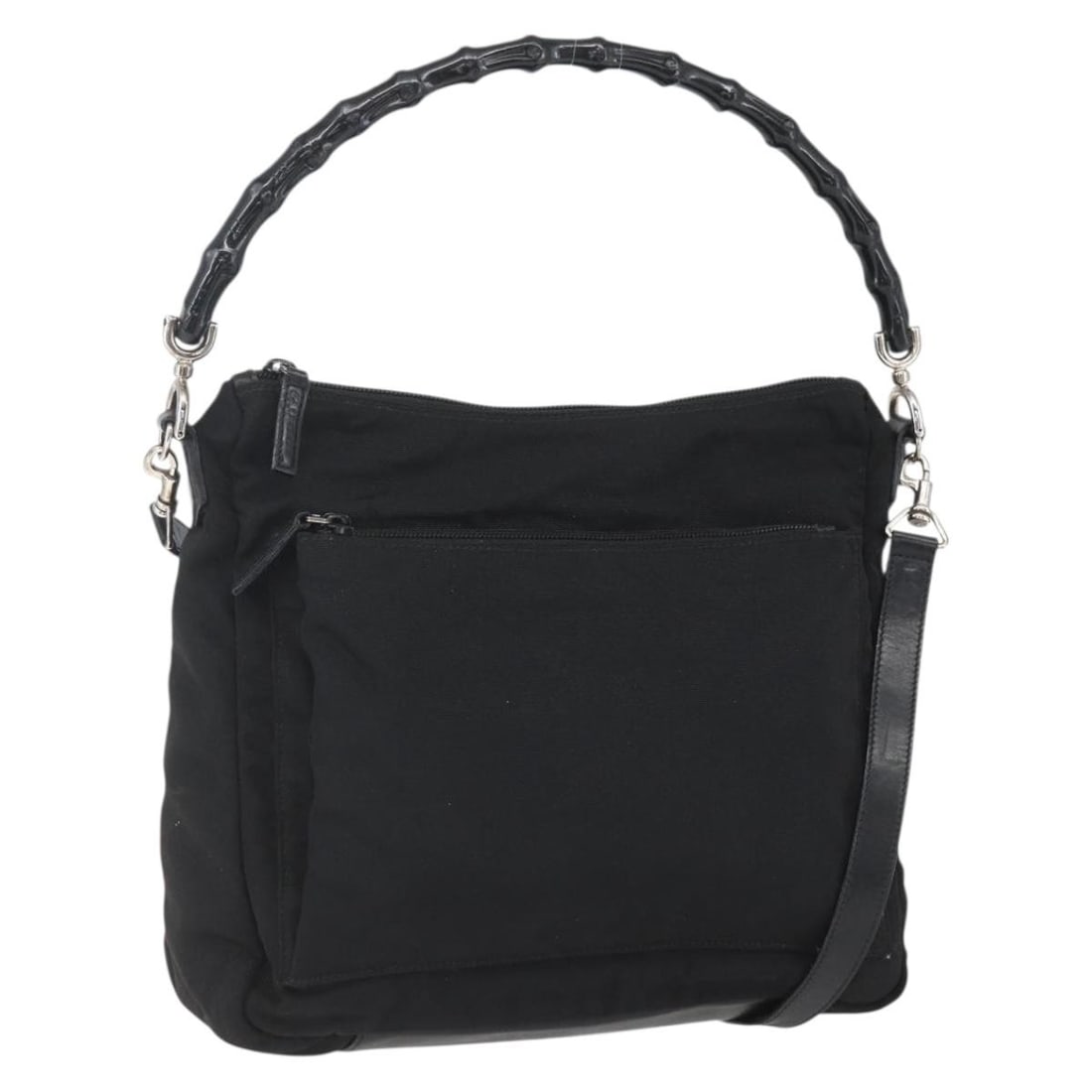 Gucci Nylon Shoulder Bag with Bamboo Handle Vintage Style: Gucci Nylon Shoulder Bag with Bamboo Handle Vintage Style This pre-owned Gucci vintage bamboo shoulder bag for women is crafted from black nylon with leather accents. It features a bamboo handle and o