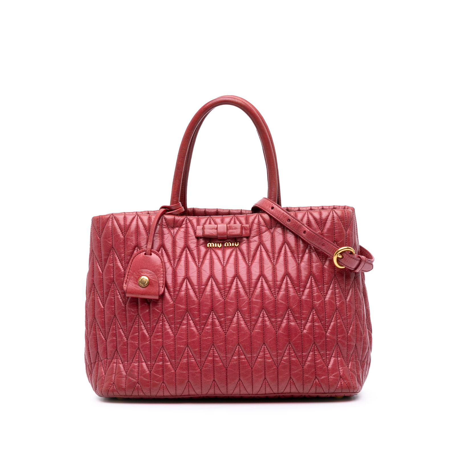 Miu Miu Pink Matelasse Lambskin Satchel with Rolled Handles: Miu Miu Pink Matelasse Lambskin Satchel with Rolled Handles This Miu Miu Matelasse Lambskin Satchel is crafted from luxurious quilted leather in a charming pink hue. It features rolled handles for eas