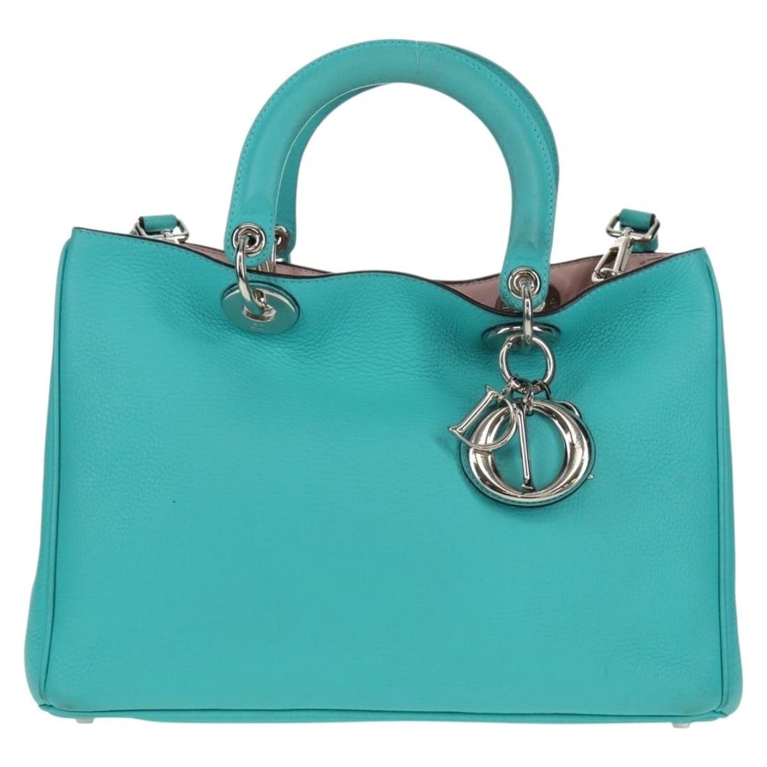 Diorissimo Turquoise Pebbled Leather Tote Bag by Christian Dior: Diorissimo Turquoise Pebbled Leather Tote Bag by Christian Dior This Christian Dior Diorissimo Tote is crafted from pebbled turquoise leather. Designed for women, the bag features structured dimension
