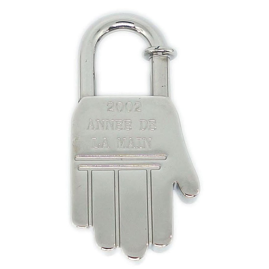 Hermes Silver Cadena Charm From 2002 Mediterranee Collection: Hermes Silver Cadena Charm From 2002 Mediterranee Collection This Hermes 2002 Annee Mediterranee Cadena charm is a vintage accessory crafted in silver tone. Made in France, it features a classic charm