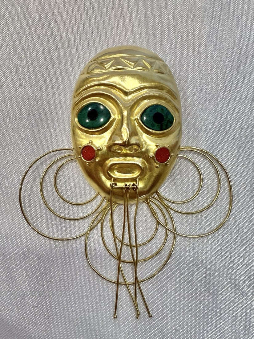 Swiss 18K Yellow Gold Enameled Mask Pendant Brooch: Swiss 18K Yellow Gold Enameled Mask Pendant Brooch Discover the elegance of this exquisite Swiss mask pendant brooch, expertly crafted from 18k yellow gold with exquisite enameling. This stunning piec