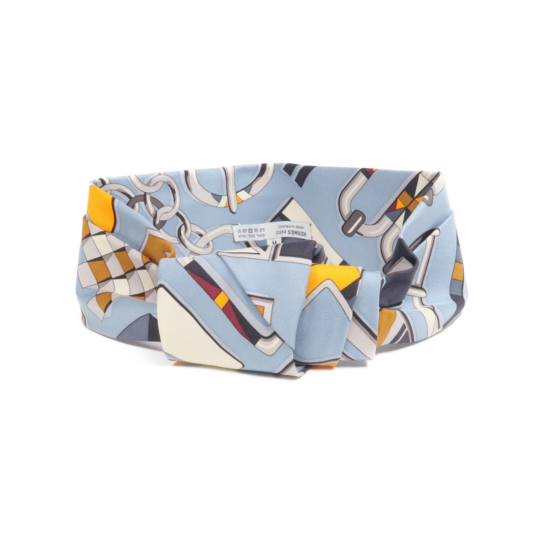 Silk Blue Hair Accessory from Hermes France: Silk Blue Hair Accessory from Hermes France This Hermes hair band is crafted from silk in a grayish blue color, offering a refined accessory for any look. Made in France, it features a regular size an