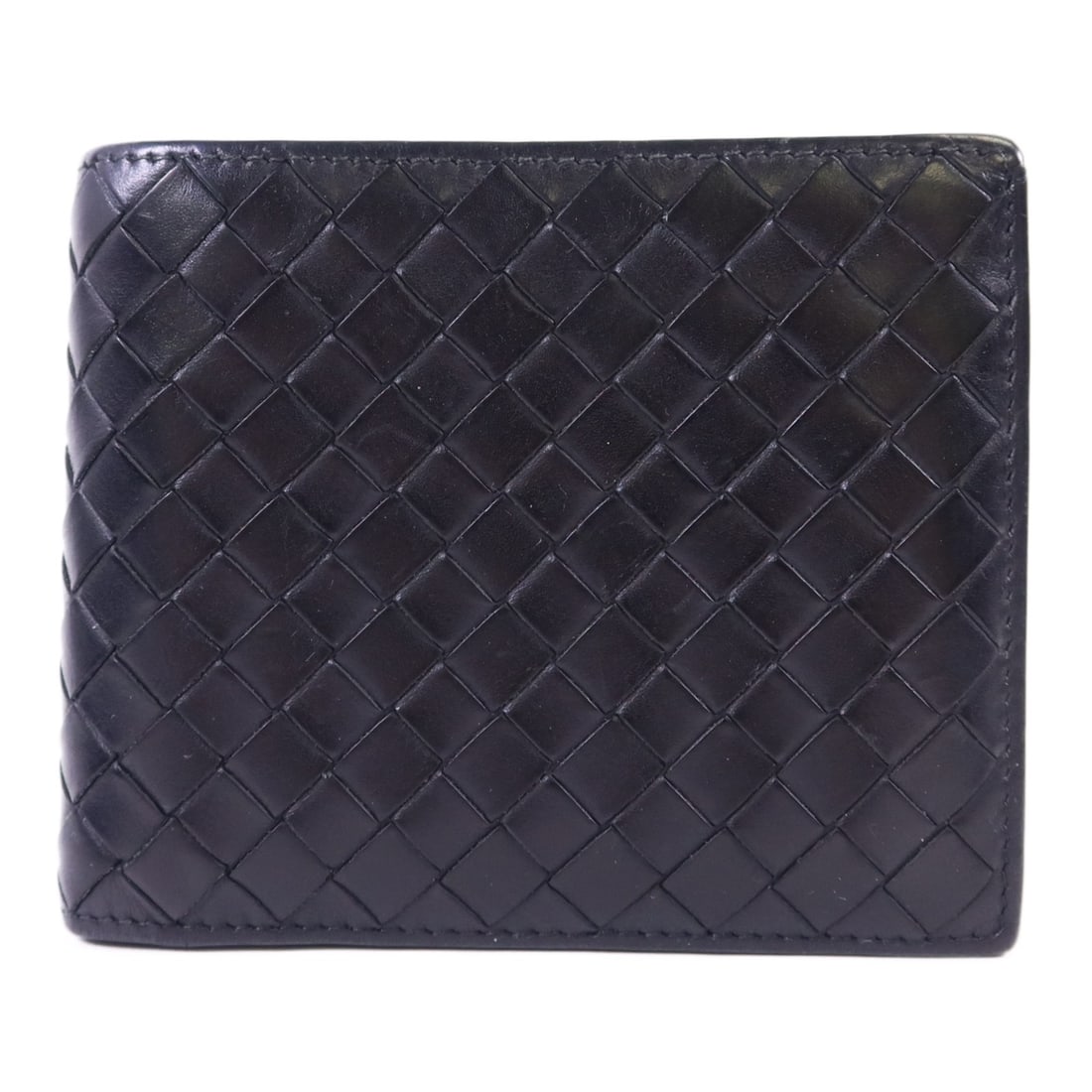 Bottega Veneta Black Lambskin Leather Bifold Wallet: Bottega Veneta Black Lambskin Leather Bifold Wallet This Bottega Veneta bi-fold wallet is crafted from supple black lambskin leather, offering a classic and elegant accessory for everyday use. Made in