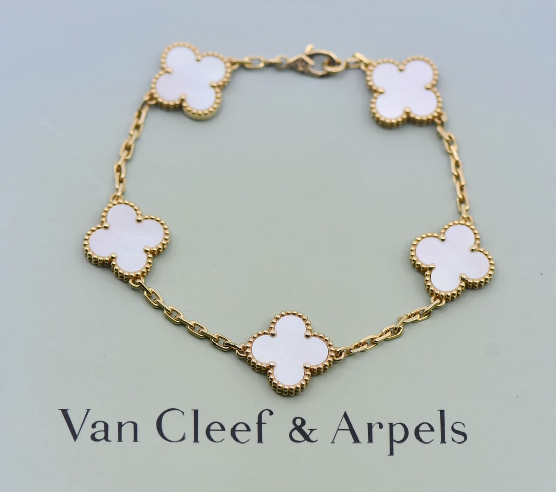 Van Cleef Arpels Vintage Alhambra Yellow Gold 18k Bracelet with Box: Van Cleef Arpels Vintage Alhambra Yellow Gold 18k Bracelet with Box This Van Cleef & Arpels Vintage Alhambra bracelet is crafted from 18K yellow gold and features the iconic Alhambra charm design. The