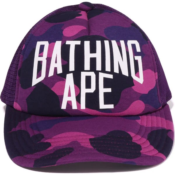 Purple Mesh Snapback Hat with BAPE Color Camo and NYC Embroidery: Purple Mesh Snapback Hat with BAPE Color Camo and NYC Embroidery This A Bathing Ape Color Camo NYC Logo Purple Mesh Cap features BAPE's signature Color Camo pattern and an embroidered "NYC" logo on th